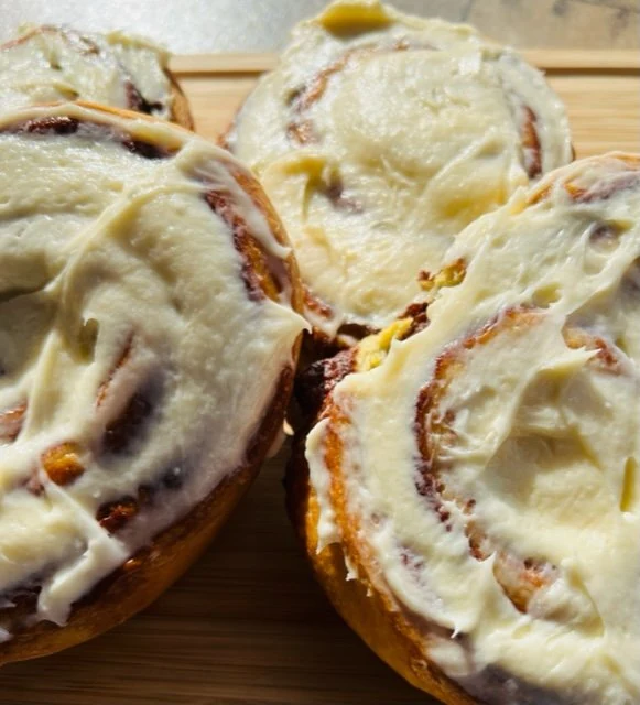 House-baked cinnamon rolls finished with icing